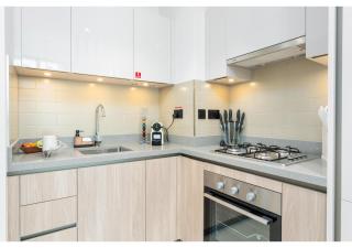 Charming 1BR with Cozy Balcony at Sobha Waves by Vibel - Dubai - 1