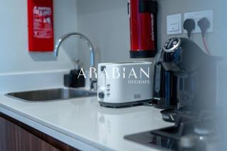 Cozy 1BR Apartment with Balcony in Business Bay - 9