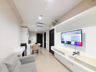 Minimalist and Cozy 1BR at Patraland Amarta Apartment By Travelio - Kejayan - 2