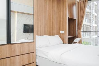 Cozy and Minimalist Studio Room at Sky House BSD Apartment By Travelio - 0