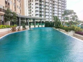 Homey and Tidy Studio at The Oasis Apartment By Travelio - Bekasi - 2