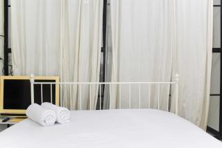 White and Nice 1BR at Bassura City Apartment By Travelio - 6