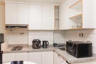 Nice and Elegant 1BR Apartment at Mustika Golf Residence By Travelio - Bekasi - 1