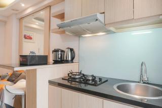 Fully Furnished with Elegant Design 2BR Bassura City Apartment By Travelio - 1