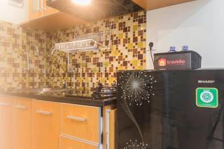 Comfy and Homey Studio Room at Grand Kamala Lagoon Apartment By Travelio - 9