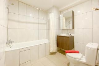 Chic and Cozy 2BR Grand Kamala Lagoon Apartment By Travelio - Bekasi - 2