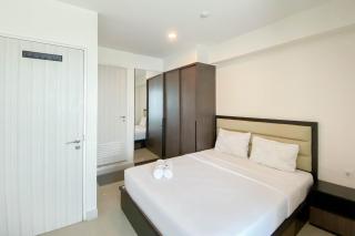 Chic and Cozy 2BR Grand Kamala Lagoon Apartment By Travelio - Bekasi - 1