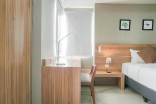Minimalist and Cozy Stay 1BR Apartment at Mustika Golf Residence By Travelio - Bekasi - 7