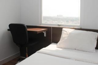 Homey and Minimalist 2BR at Patraland Urbano Apartment By Travelio - Bekasi - 9