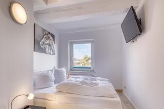 Ferienwohnung Seehus - Modernes Ferienhaus mit Sauna, Seezugang und Bootsanlegeplatz - Malchow - 4