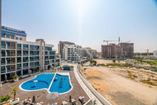 Luxury 1BR pool view flat w gym in Samana Hills - Dubai - 8
