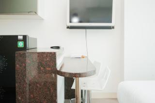 Homey and Cozy Studio Room at Tree Park City BSD Apartment By Travelio - 1