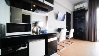 Homey Studio No Kitchen at Grand Darmo Suite Apartment By Travelio - 1