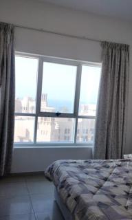 Elegant Sea View Bedroom with Shared Balcony and WC, Spacious and Serene Retreat - ROOM INSIDE APARTMENT - Ajman - 7