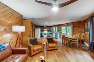 Hexagonal log cabin in woods - 0