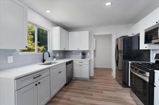 Modern family-friendly home with garage, yard - 2