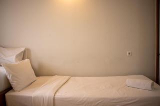 Modern and Classic 1BR at Evenciio Margonda Apartment By Travelio - 9
