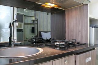 Cozy and Enjoy Studio Room at Green Pramuka City Apartment By Travelio - 4