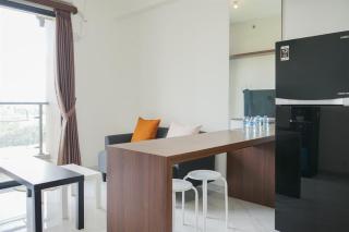 Comfort and Minimalist 2BR at Sky House BSD Apartment By Travelio - 1