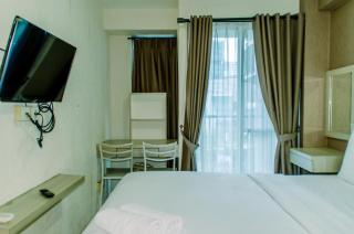Homey and Warm Studio Room at Tifolia Apartment By Travelio - 6