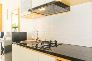 Comfortable Patraland Urbano Studio Apartment near Train Station By Travelio - 2