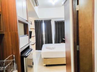 Homey and Comfy Studio at Vida View Makasar Apartment By Travelio - 7