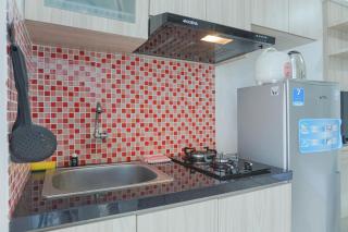 Cozy Stay and Homey Studio Apartment at Bassura City Apartment By Travelio - 3
