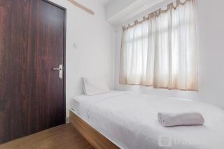 Modern Look and Comfortable 2BR Serpong Greenview Apartment By Travellio - Tangerang - 0