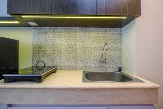 Cozy Stay and Tidy Studio at Evenciio Margonda Apartment By Travelio - Depok - 4