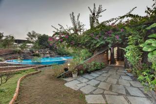 SaffronStays Terracotta Trails - 2BR eco-luxury villa with earthy design, pool, open lawns & sustainable living in Wada - 2
