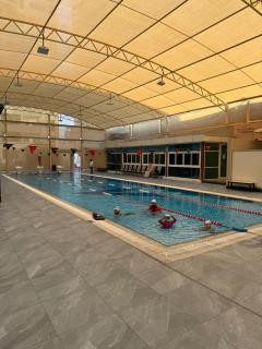 Luxury 2 bedroom next to beach with swimming pool gym and kids play area - Ajman - 8