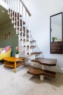 En-suite with double bed on mezzanine and desk in family home - Hertford - 4