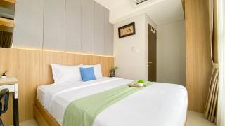Homey and Good Place 2BR Transpark Bintaro Apartment By Travelio - 7