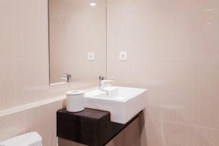 Comfort Living 1BR without Living Room at Bintaro Embarcadero Apartment By Travelio - 1