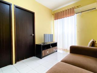 Warm and Cozy 2BR Mutiara Bekasi Apartment By Travelio - 1