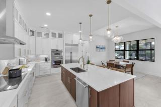 Exquisite waterfront Home featuring a pool and hot tub - 2