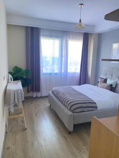 unparalleled luxurious elegant two bedroom apartment with heated swimming pool ,modern equipped gym, free parking space and relaxing rooftop with amazing city views - Nairobi - 2