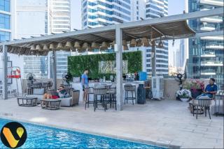 Vogue DAMAC Maison Prive Balcony & Pool with Canal View Prime Business Bay Location, Steps from Downtown & Burj Khalifa - 8