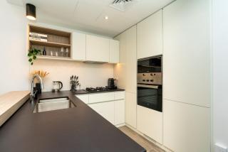 Sleek & Modern 1BR with Luxury Pool in JVC - 9