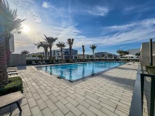 1BR Oasis with Pool, Gym, and Kid's Playground - Dubai - 9