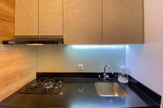 Elegant and Homey Studio Ciputra World 2 Apartment By Travelio - 1