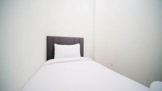 Cozy Living and Tidy 2BR at Puncak Dharmahusada Apartment By Travelio - Plosobegem - 5