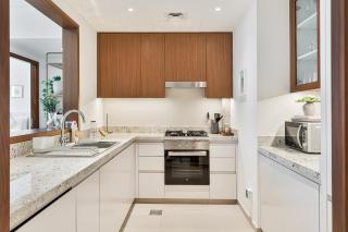 Stylish 1BR with Pool, Gym, BBQ Area & Playground - 1