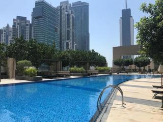 Stylish 1BR with Pool, Gym, BBQ Area & Playground - 7
