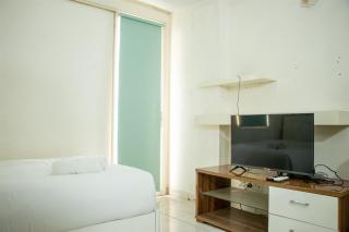 Homey and Cozy Stay Studio at Margonda Residence 2 Apartment By Travelio - 5