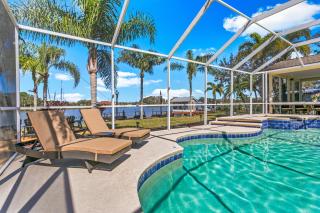 Luxe Waterfront Hideaway w Pool Pirate Ship Dock - 2