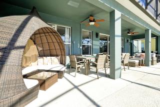 Waterfront Villa showcasing a theater, games room, and a private pool - 8