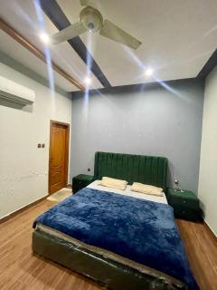 1 Bed Apartment TV Lounge and Equipped kitchen - Multan - 9