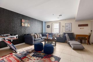Newark Gem 6BR, 5BA - Sleeps 20 - Walk to Prudential Center and Newark Penn Station, Near EWR and American Dream Mall, includes Parking - WiFi - Laundry - Backyard - Gym - Newark - 6