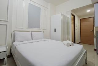 White and Cozy Studio at Vida View Makassar Apartment By Travelio - Pampang - 6
